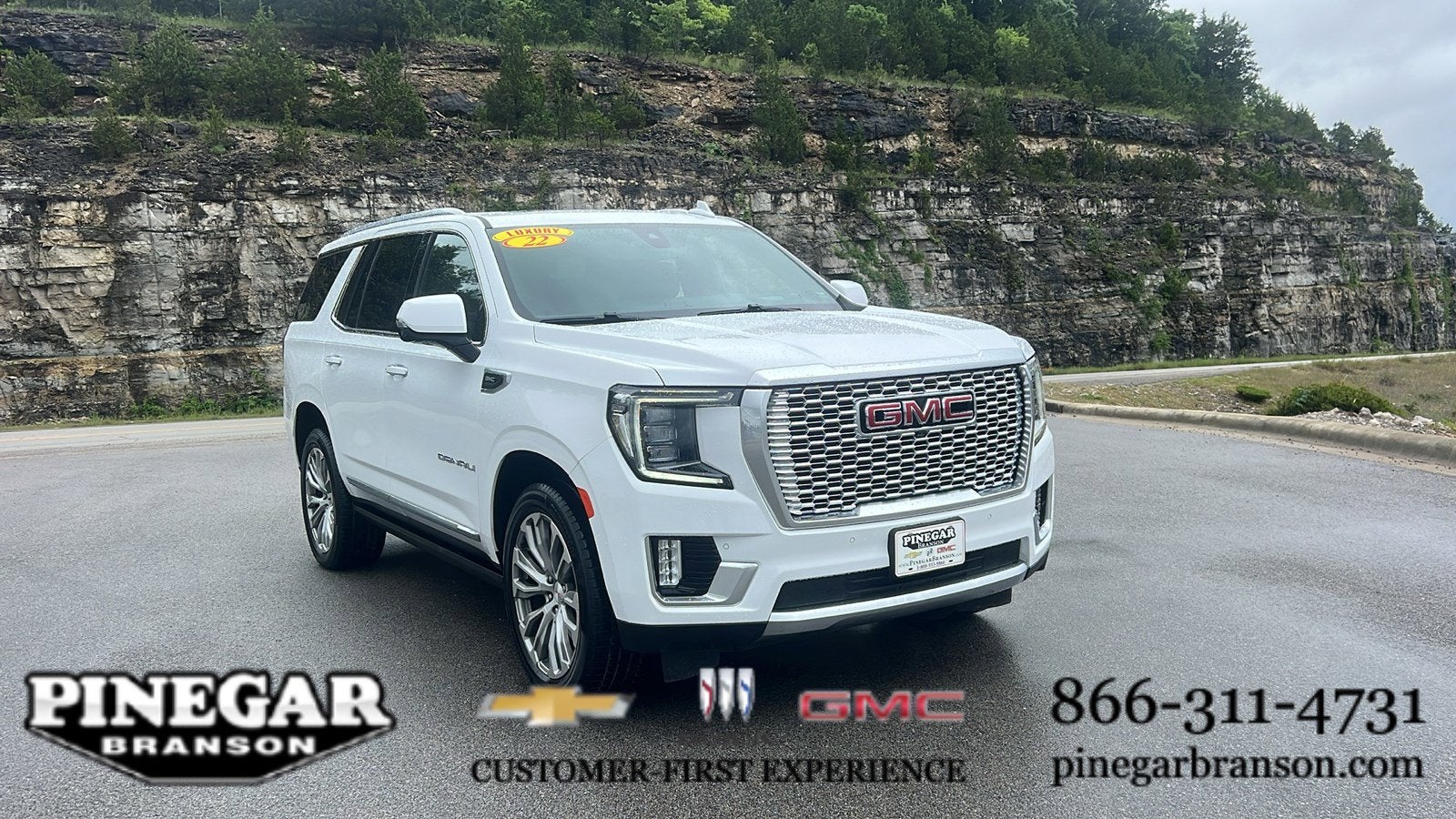 2022 GMC Yukon Denali in Summit White — front three-quarter view
