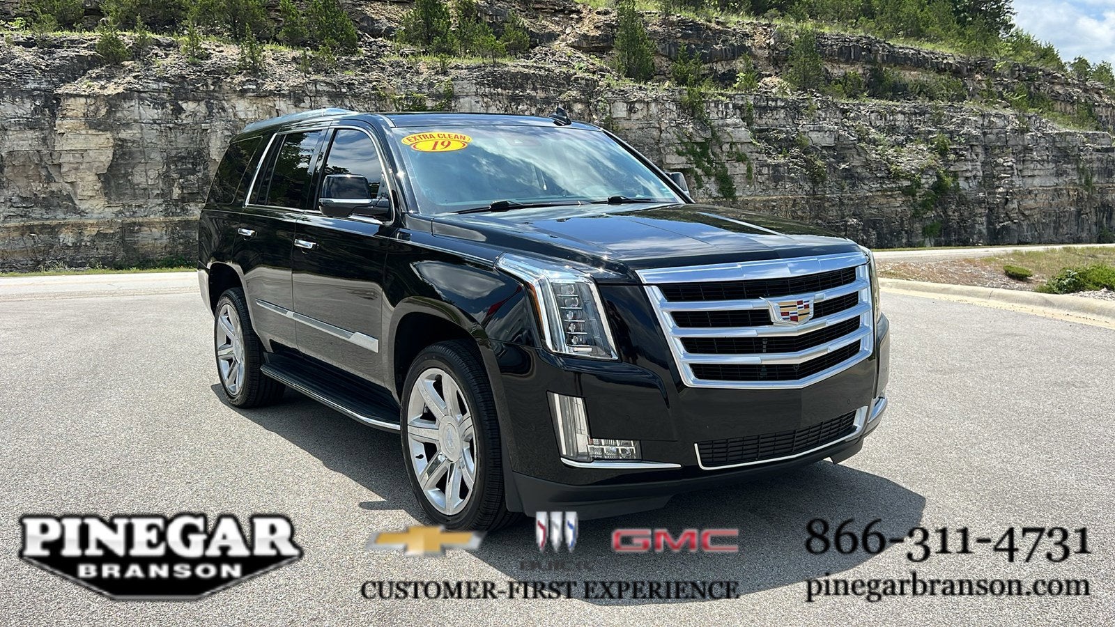 2019 Cadillac Escalade Luxury in Black Raven — front three-quarter view