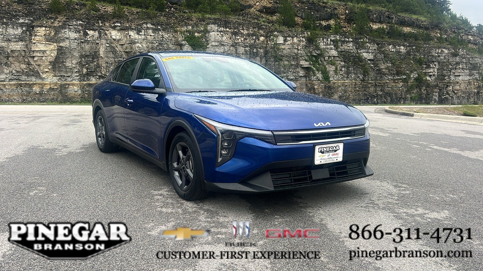 2025 Kia K4 LXS in Blue — front three-quarter view